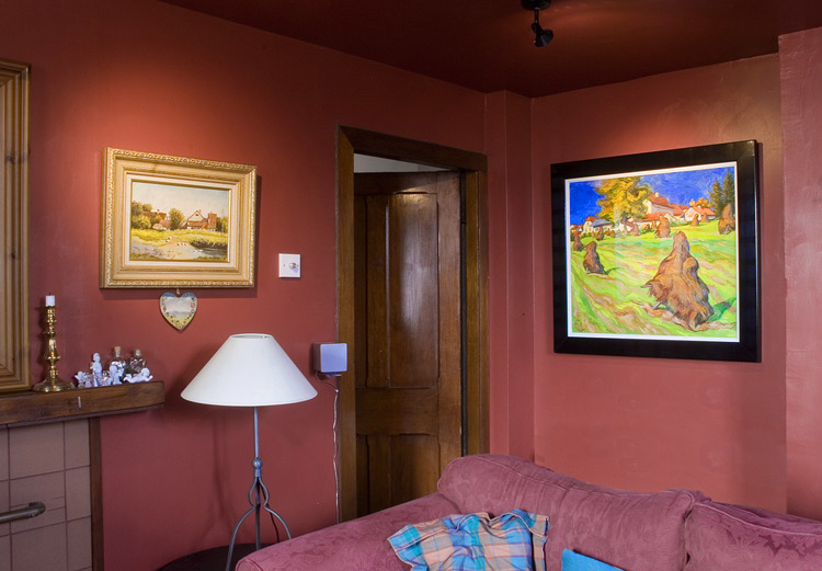 Small haystacks painting in a home interior