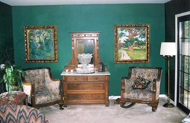 Two paintings hanging in a home interior